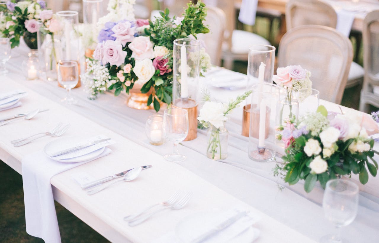 The Art of Drawing Readers In: Your attractive post title goes here A beautifully arranged wedding table with floral centerpiece and candles.